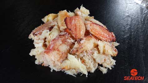 A photograph of Chilean crab meat with claw and leg meat over body meat.