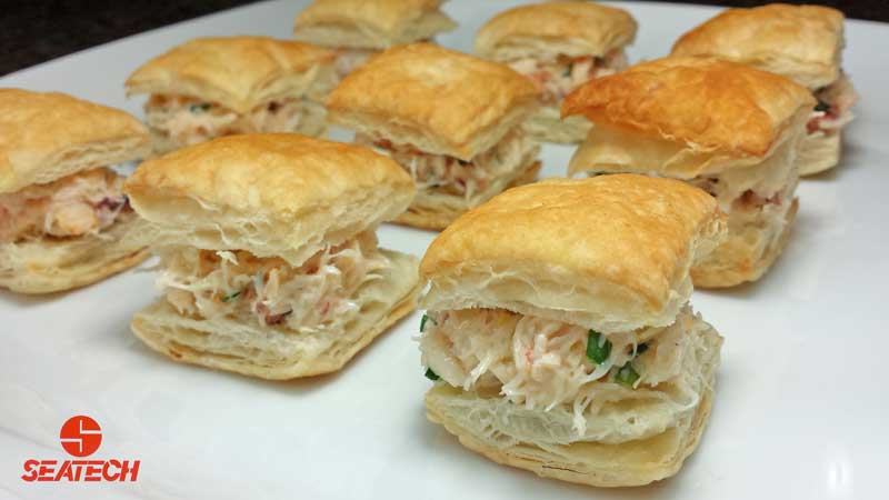 A photograph of crab puff pastry bites.